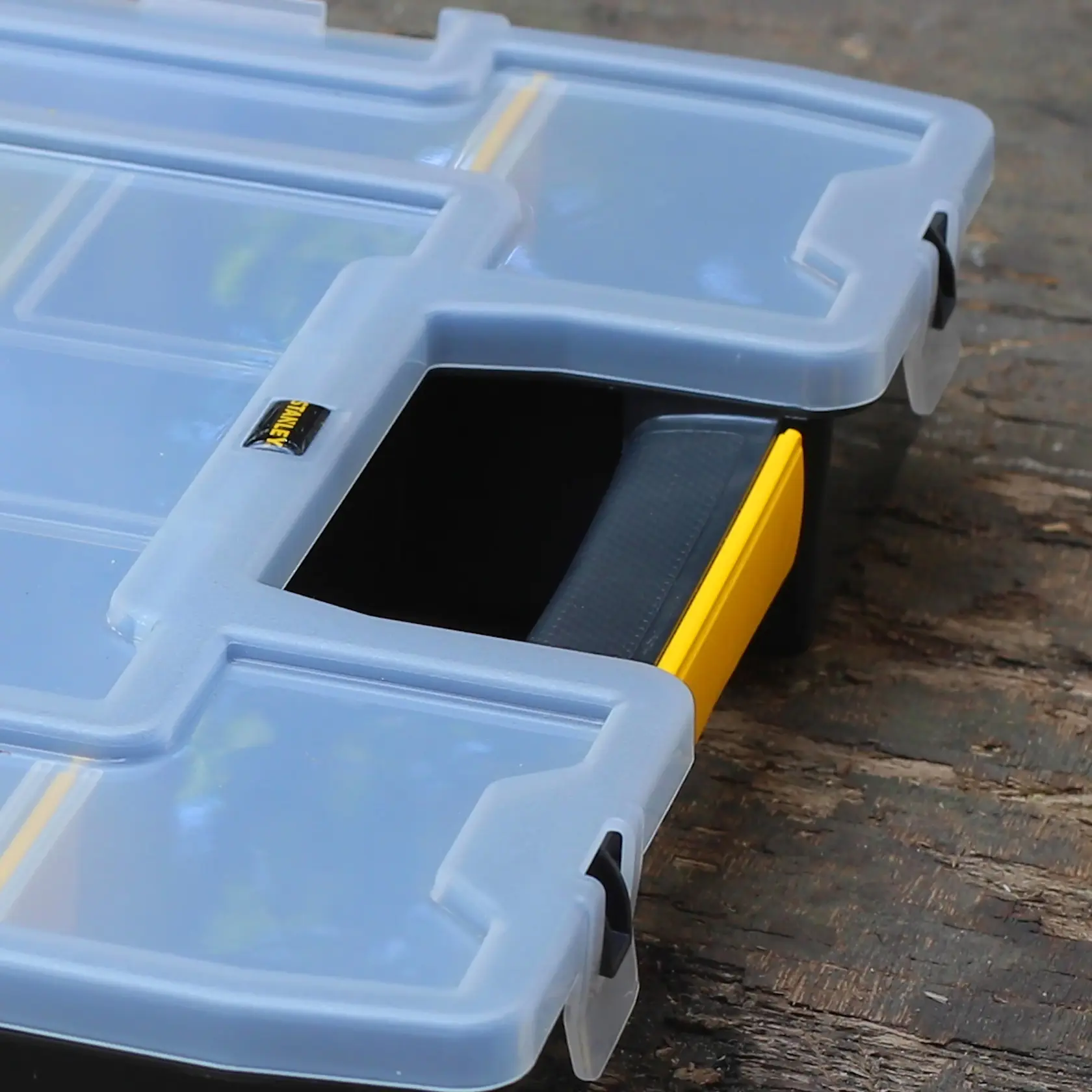 STANLEY 1-97-483 organizer with clear lid, black handle, and yellow latch, close-up view.