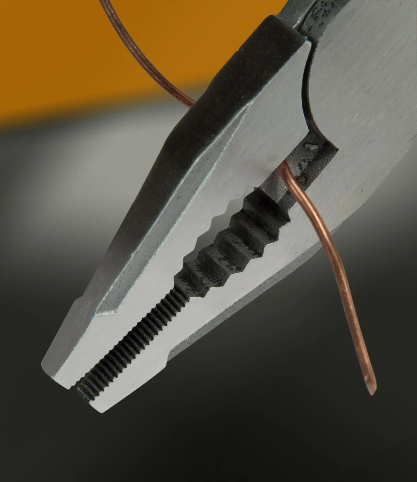 STANLEY FMHT0-72414 pliers gripping copper wire, close-up photography.
