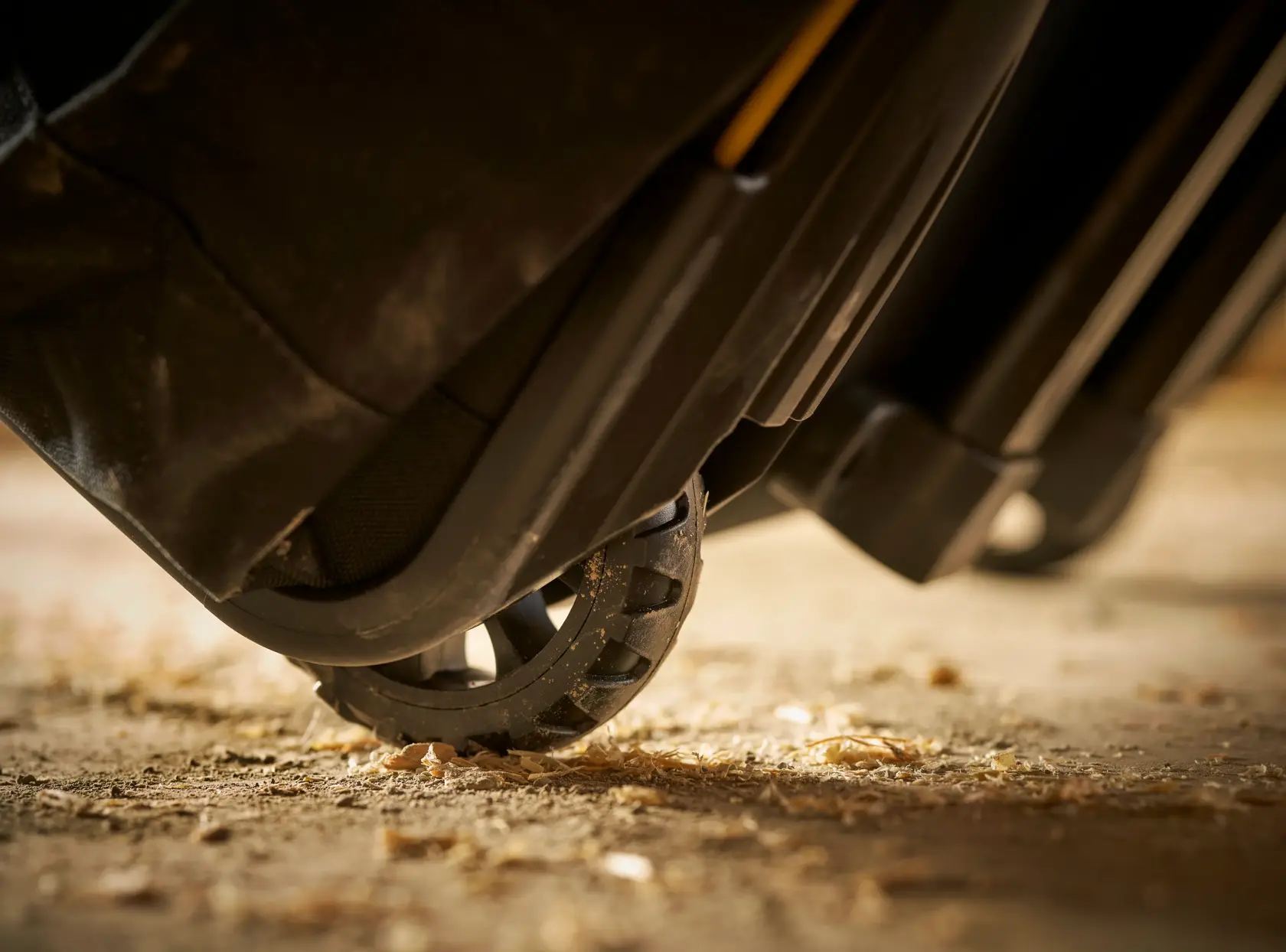 STANLEY FMST1-80148 tool bag wheel close-up on rough ground, photography showing durable construction.