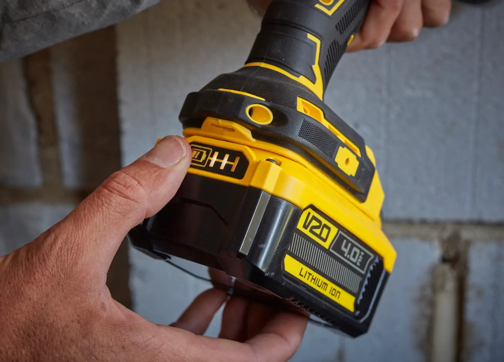 DeWalt SKU SB204-KR cordless tool close-up showing V20 4.0Ah lithium-ion battery in use.