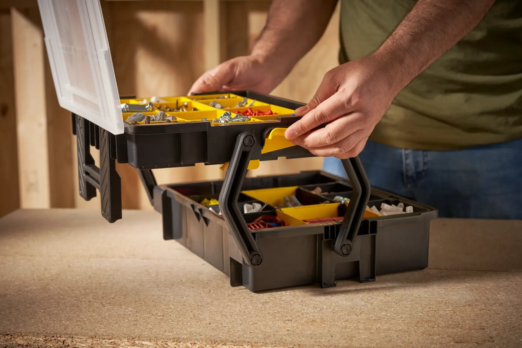 STANLEY STST1-75540 organizer box with yellow compartments, shown open on a workbench.