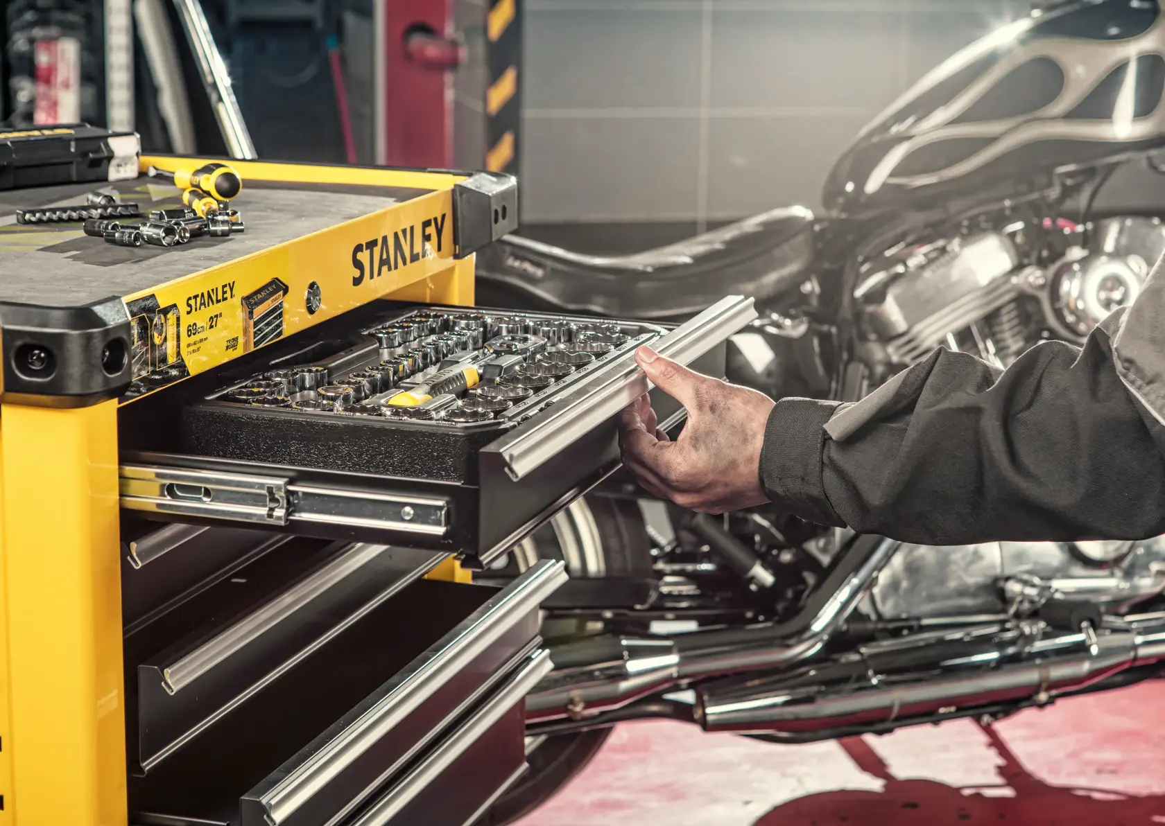 STANLEY STST74306-8 yellow tool chest photography with open drawer showing tools, angled workshop view.